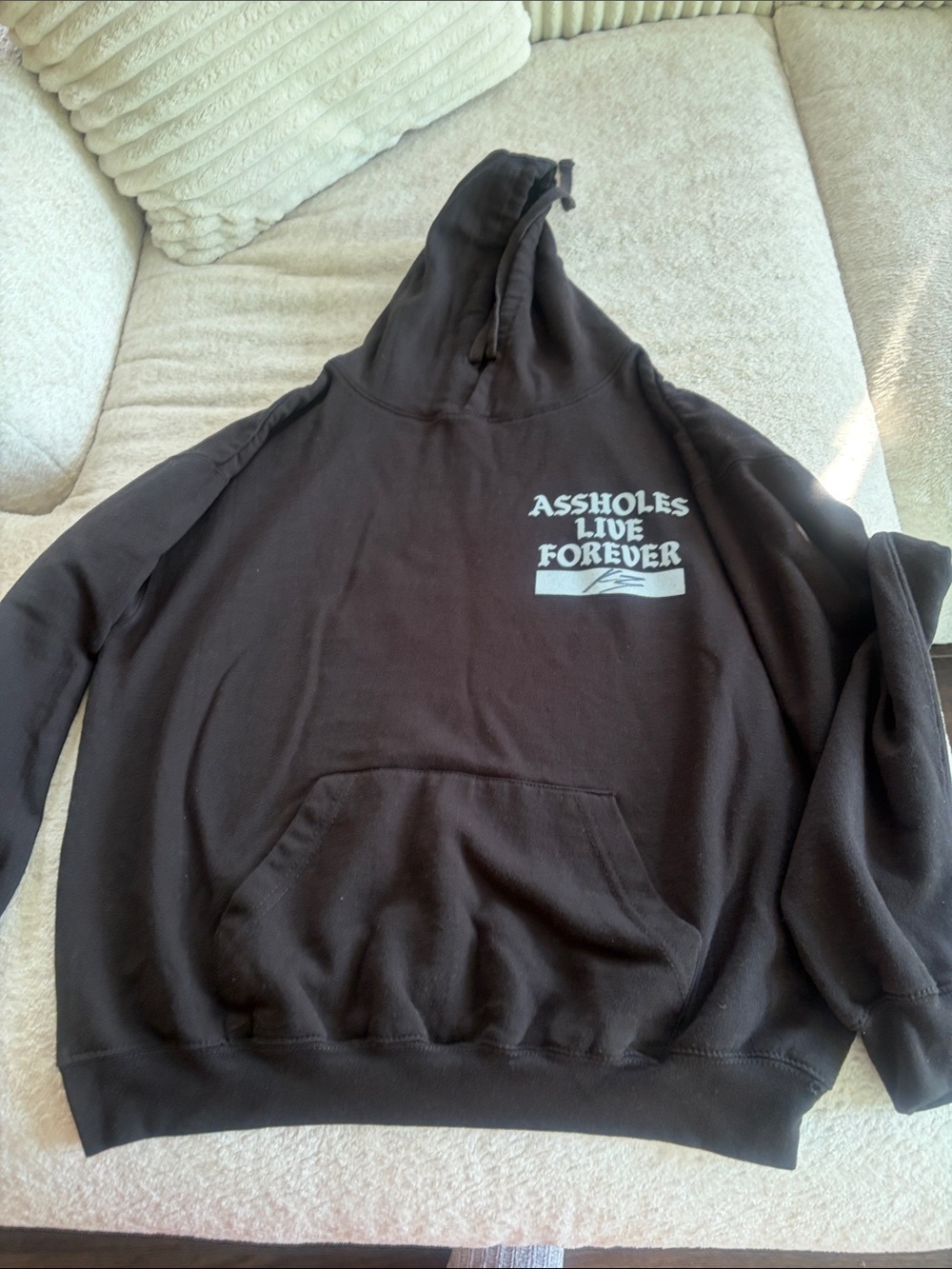 Size XL Black Hoodie with 'ASSHOLES LIVE FOREVER'
